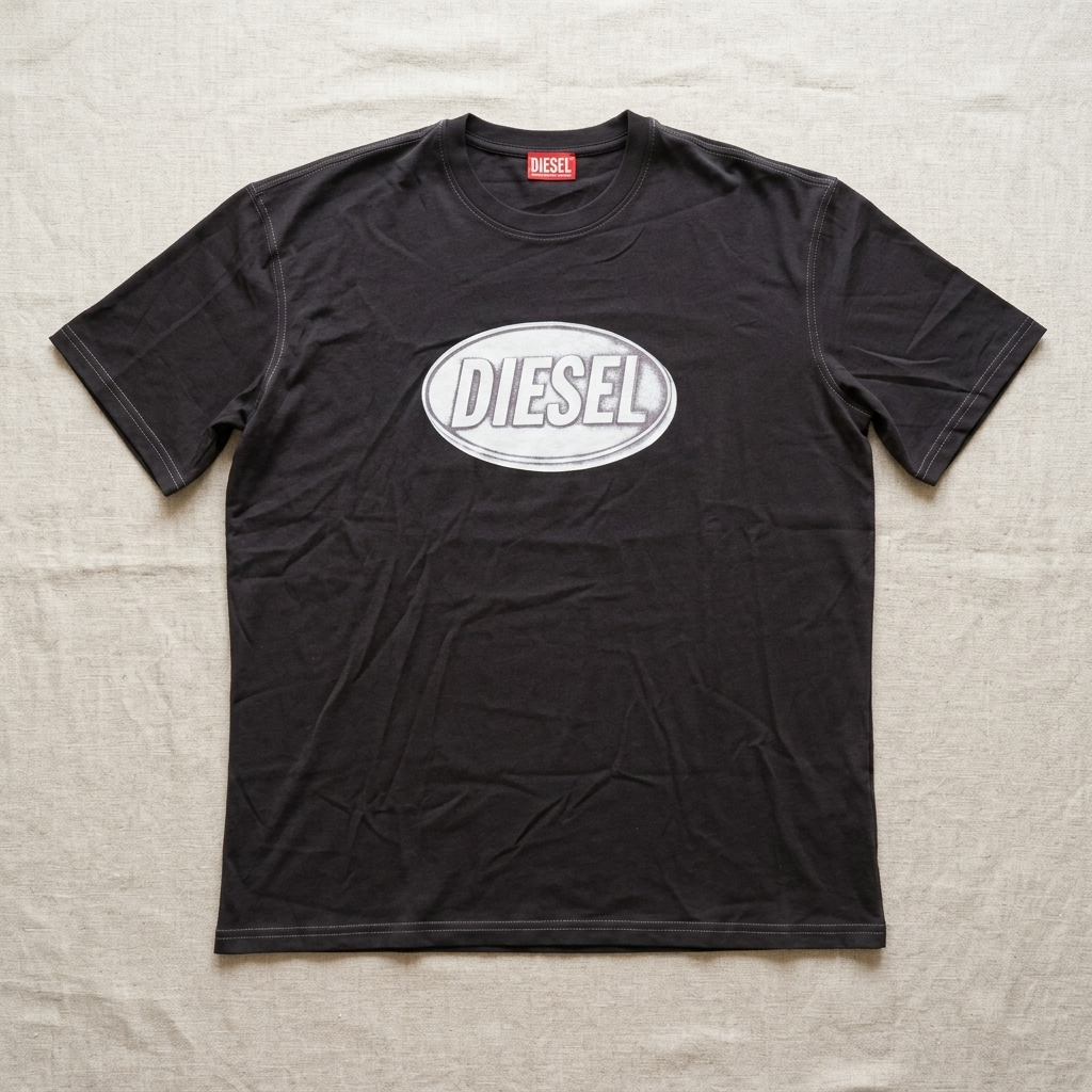 Diesel black regular fit t-shirt – man sitting in wooden interior setting showing full logo detail