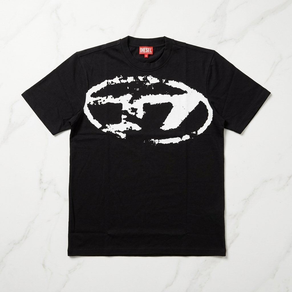 Diesel black drop shoulder t-shirt with distressed Oval D logo – flat lay on marble