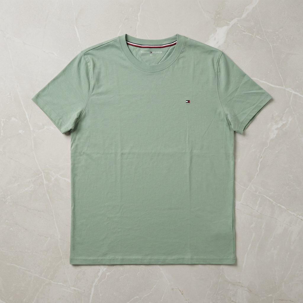 Tommy Hilfiger light green regular fit t-shirt – flat lay on marble surface showing flag logo detail
